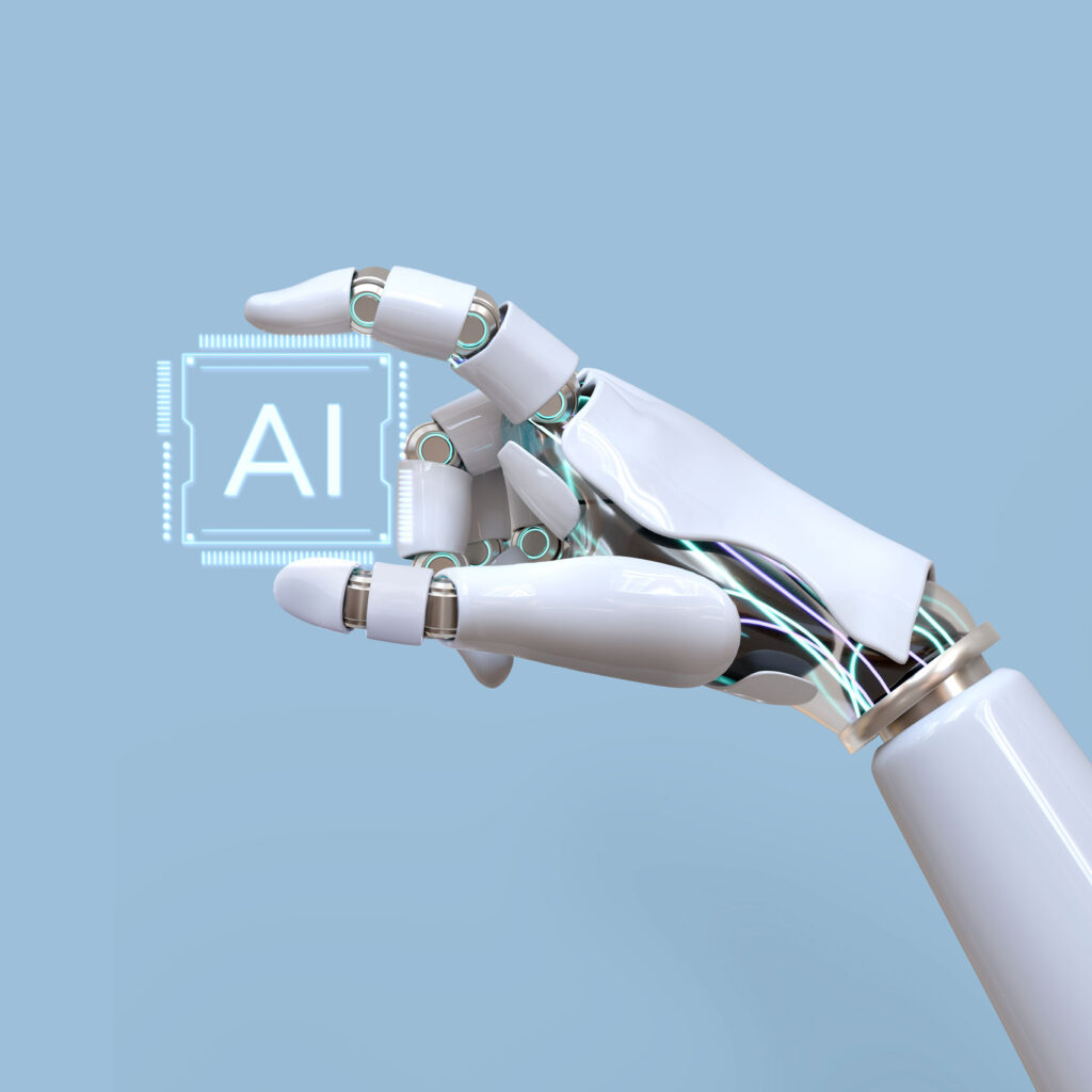 Roboterhand hält AI Symbol hoch.