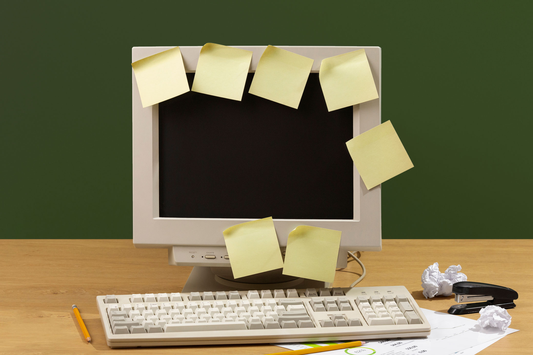 messy-office-desk-with-old-computer-still-life